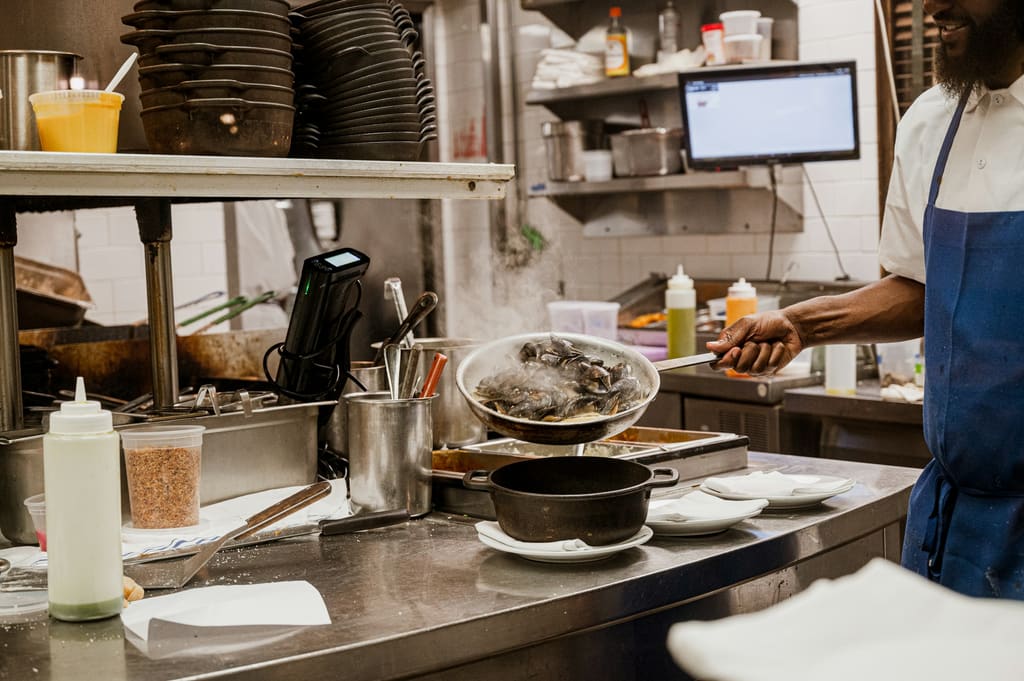 Hospitality kitchen with commercial cooking and preparation stations
