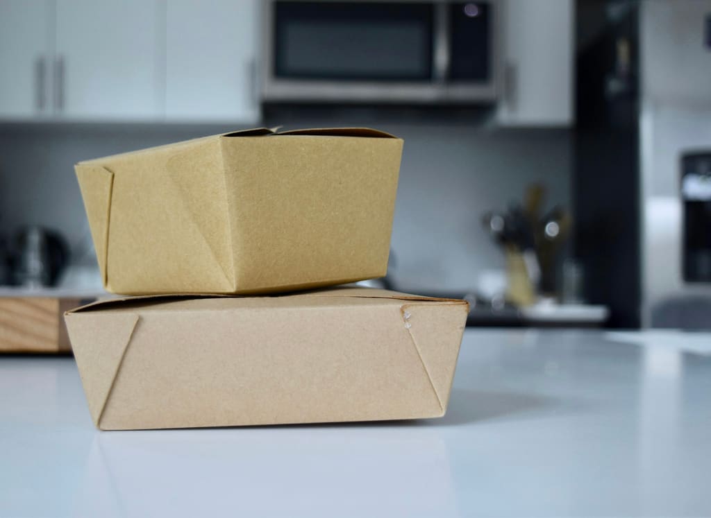 Food delivery packaging and containers prepared for dispatch